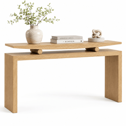 Natural wood console styled with a vase and books, showing the open rectangular frame