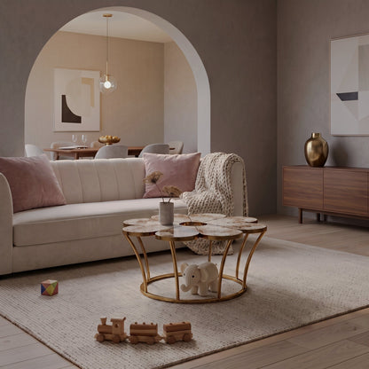 Flower-shaped veined-top coffee table with gold-tone frame beside a sofa