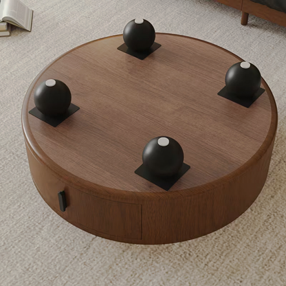 Underside view of the round coffee table and black ball feet