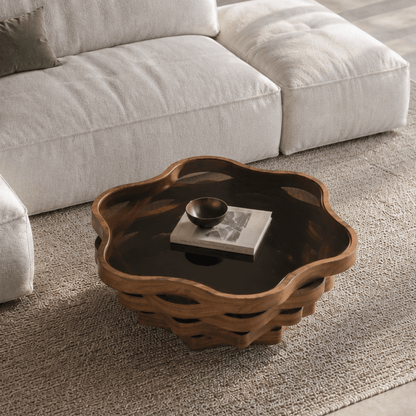 Overhead angled view of the cloud-shaped glass-top table and layered wave base