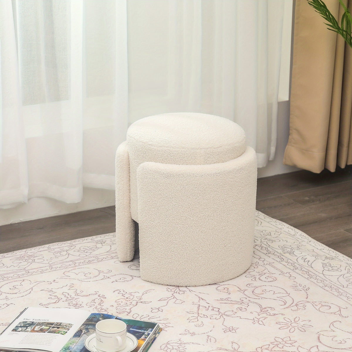 White textured stool showing its padded top and divided base