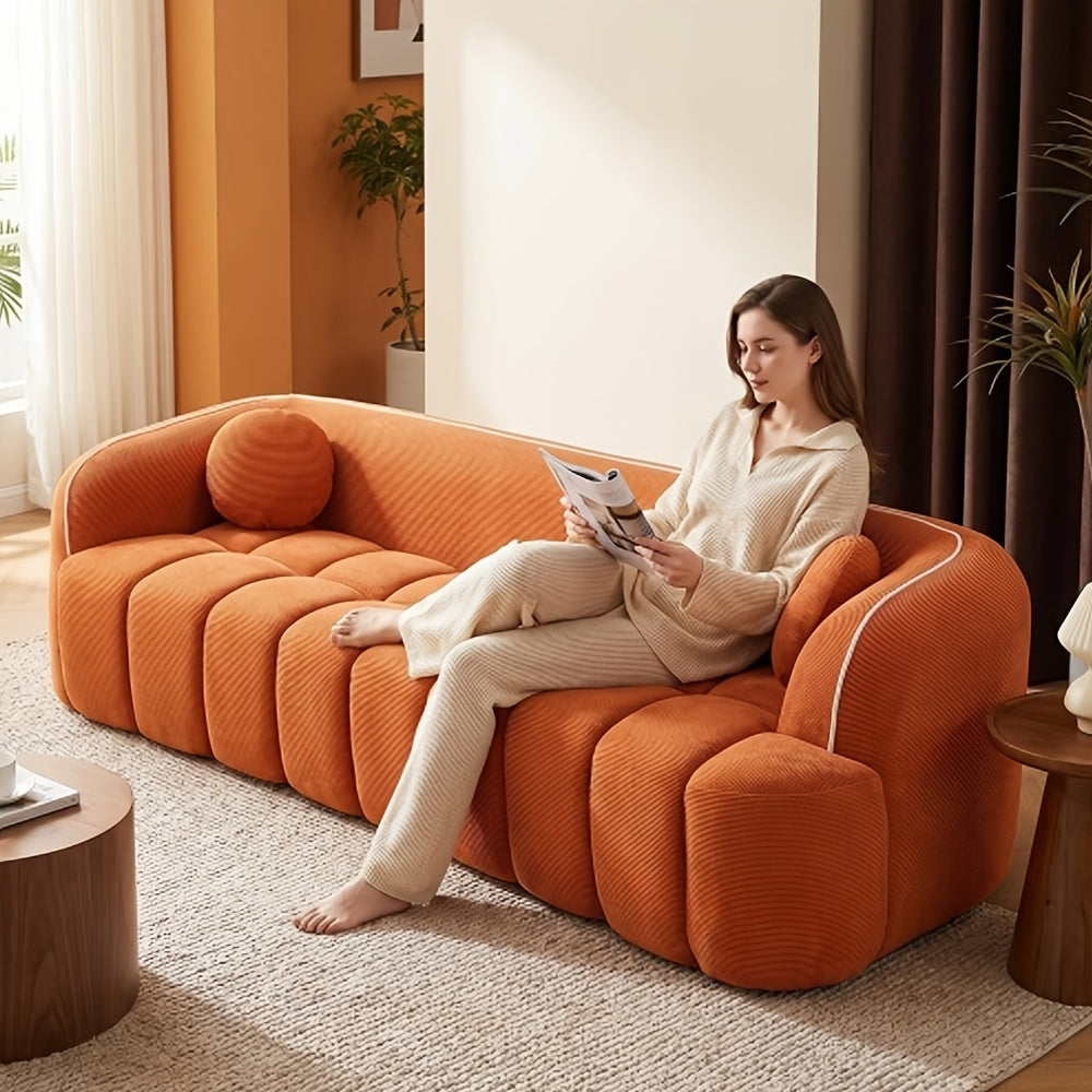 Channel-Tufted Corduroy Lounge Sofa — orange sofa lounging view.