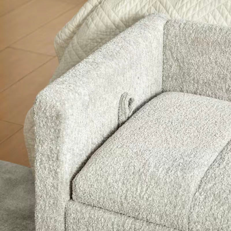 Close view of the light gray seat edge, stitching, and loop near the upholstered arm