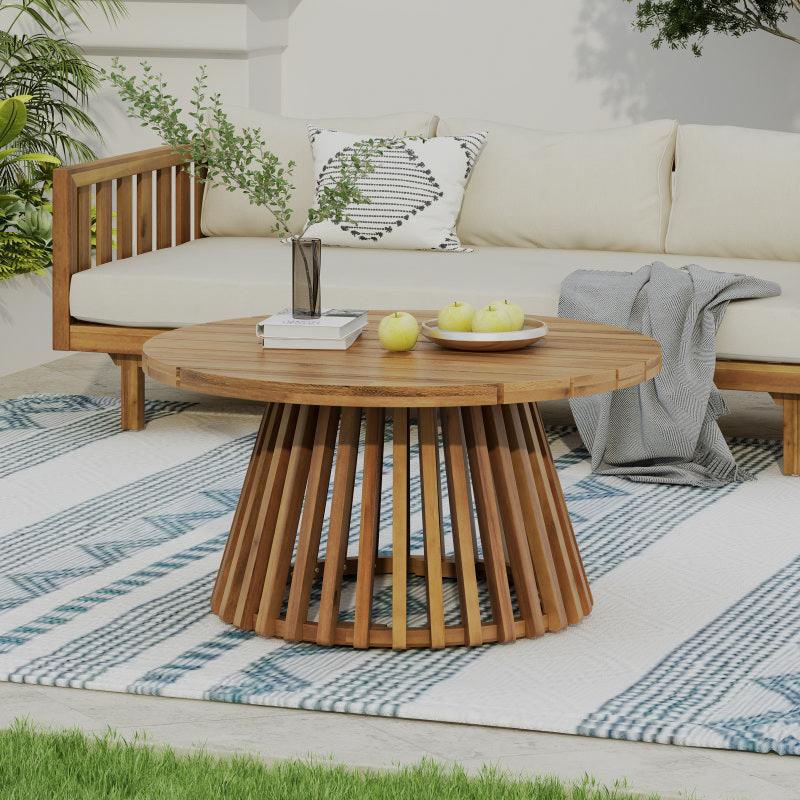 Close-up of the patio sofa's wood-look frame and matching round table