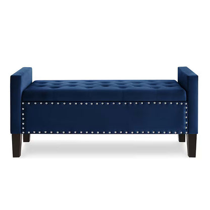 Front view of the navy tufted storage bench with nailhead trim