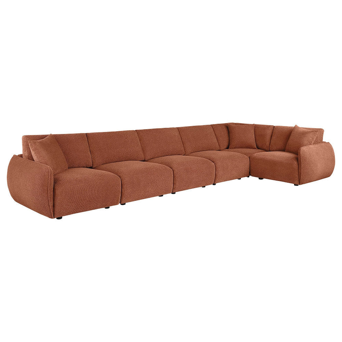 Coral Logan modular sectional in an extended corner arrangement with rounded arms and cushioned backrests.