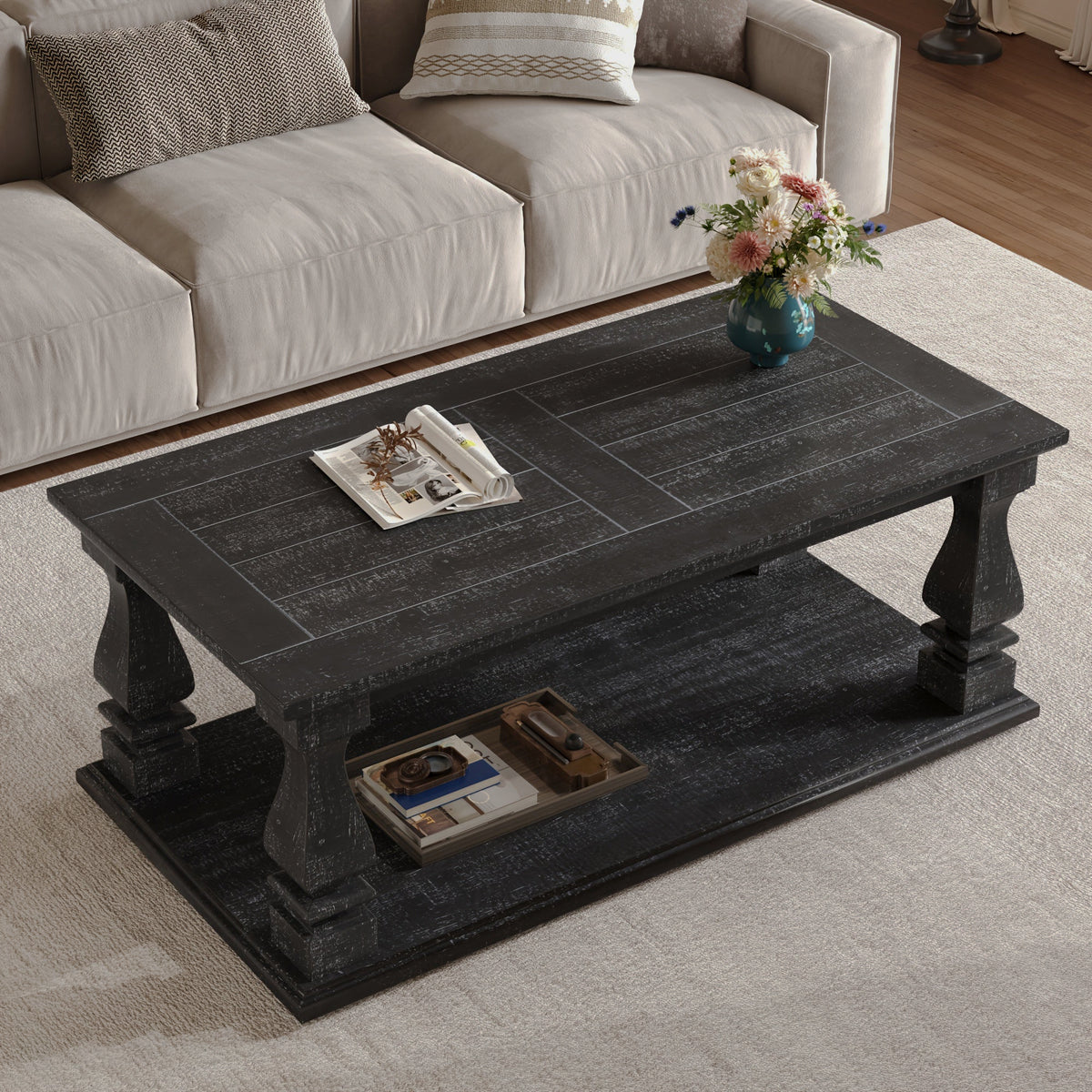 Angled overhead view of the black rectangular coffee table and lower shelf
