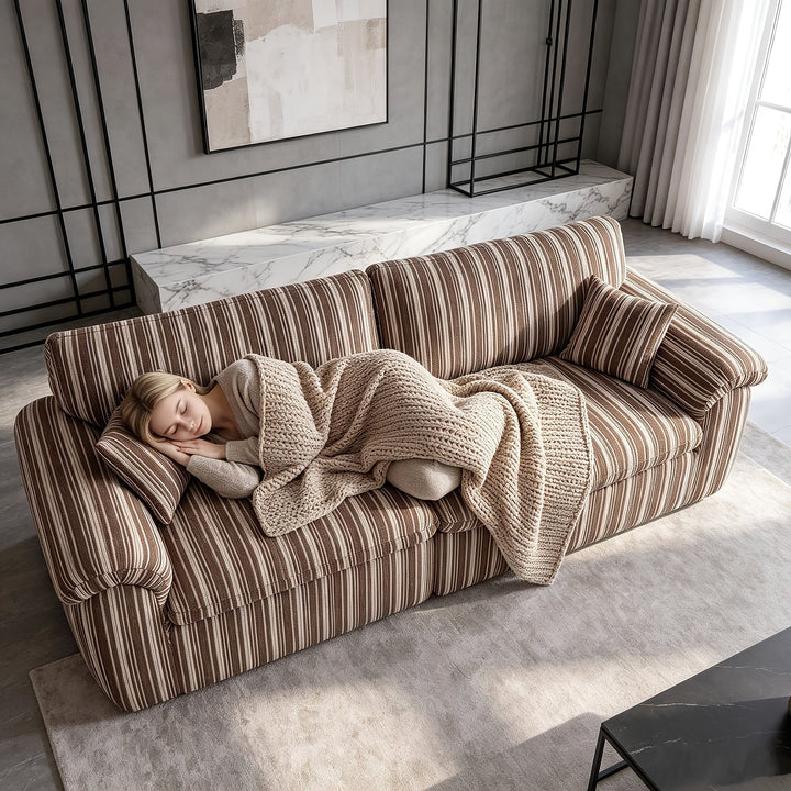 Wren Green Striped Deep-Seat Cloud Sofa — brown colorway reference shown with a reclining person; available option is green