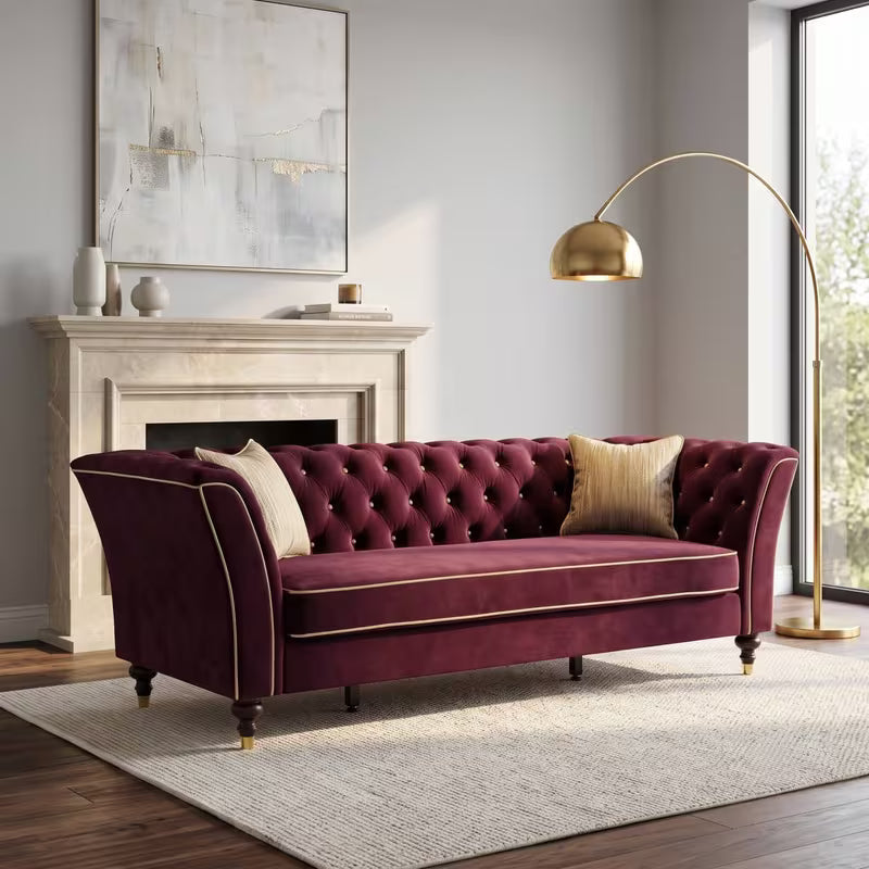 Chesterfield Sofa with Contrast Piping — burgundy sofa and contrast piping.