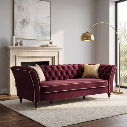 Chesterfield Sofa with Contrast Piping — burgundy sofa and contrast piping.
