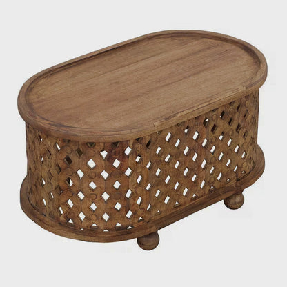 Angled studio view of an oval coffee table with a raised rim and cutout sides