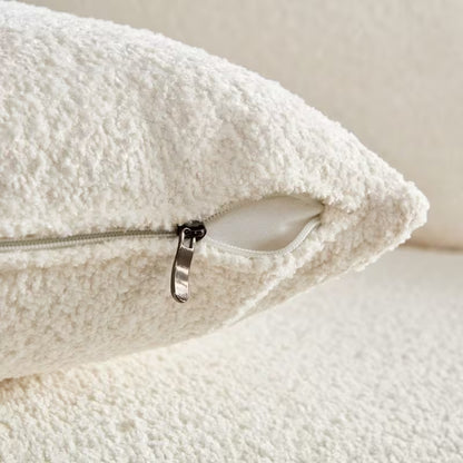 Ivory Curved Sofa with Four Pillows — pillow zipper and filling detail.