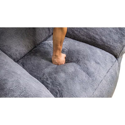 Heart-Back Faux Fur Lounge Chair — seat cushion compression demonstration.
