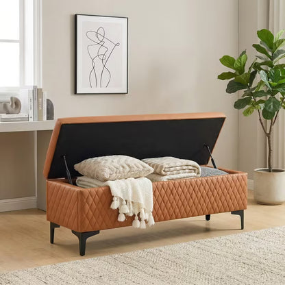 Brown bench with its hinged lid open, showing blankets in the storage compartment