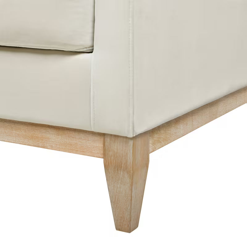 Knox French Beige Velvet Sofa — wood base, leg and upholstery seam detail.