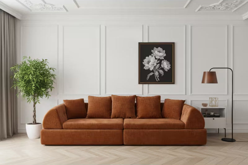 Front view of the orange modular sofa's deep seats and loose back cushions