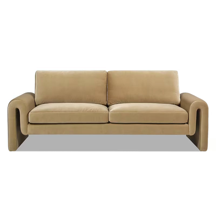 Front view of the beige Mason velvet sofa showing its open arched arms.