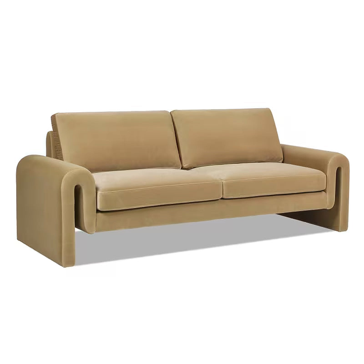 Angled view of the beige Mason sofa showing the sculptural arms and cushioned back.