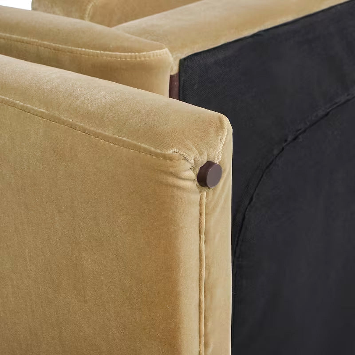 Close-up of the Mason sofa’s beige upholstery, stitched seam and underside edge.