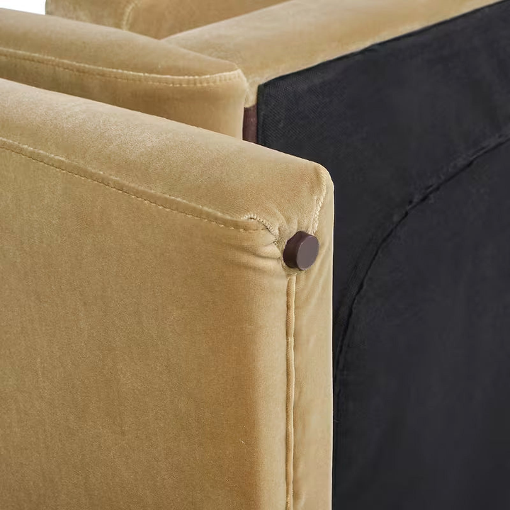 Close-up of the Mason sofa’s beige upholstery, stitched seam and underside edge.
