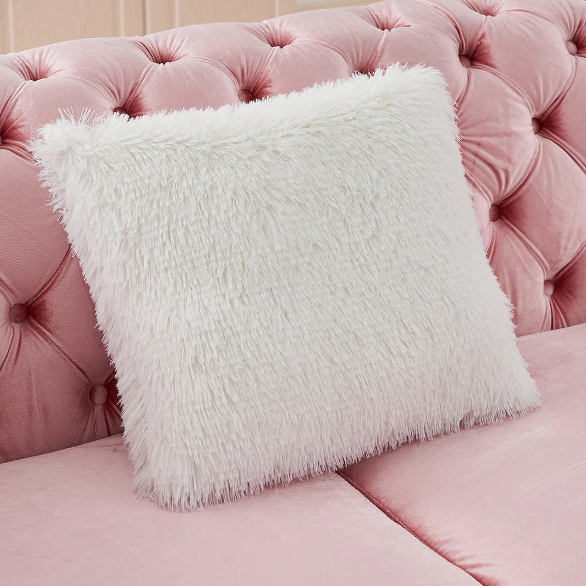 Pink velvet Chesterfield sectional - textured accent pillow